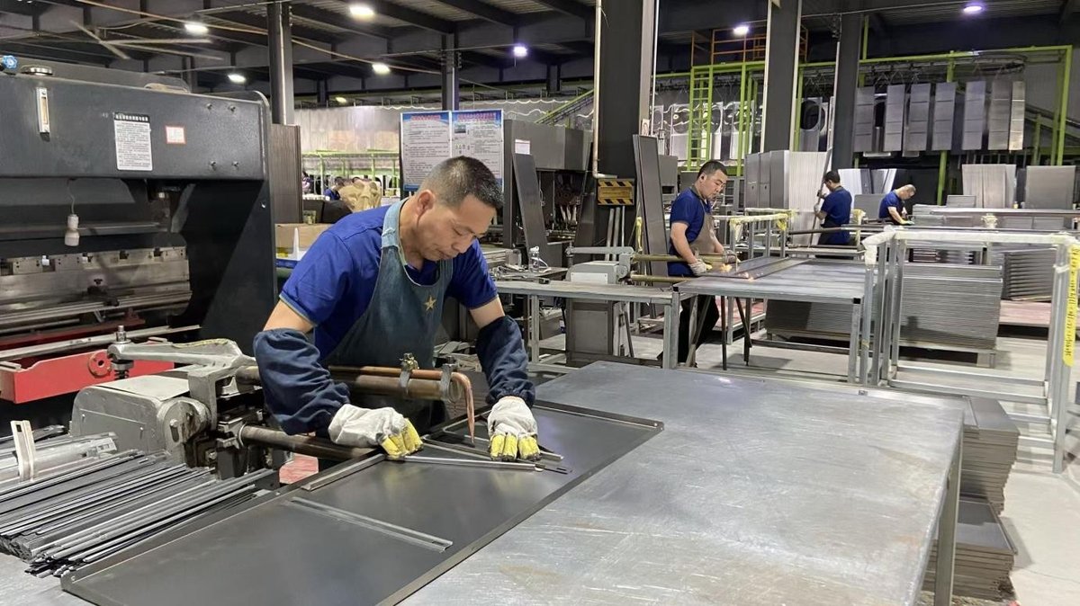 Precision welding and assembly production line for custom steel filing cabinets